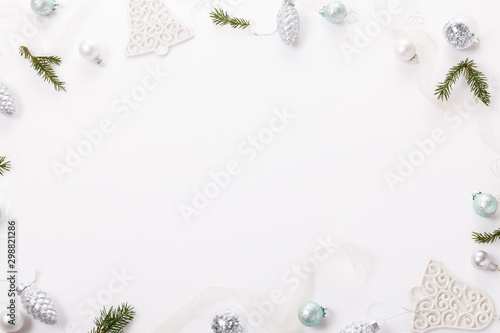 Christmas composition. Christmas balls, blue and silver decorations on white background.