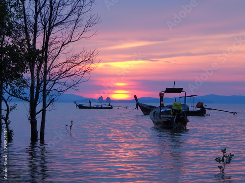 Silhouette of long tail boat with sunset background , Koh yao yai , Thailand