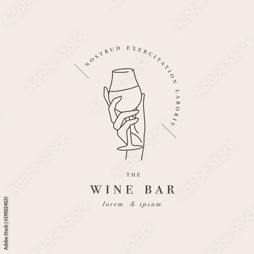 Vector design linear template logo or emblem - female hand holding glass of wine. Abstract symbol for wine bar or sommelier courses.