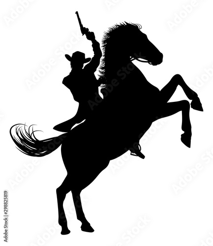 Fotografie, Obraz A cowboy riding a horse in silhouette waving pistol in the air