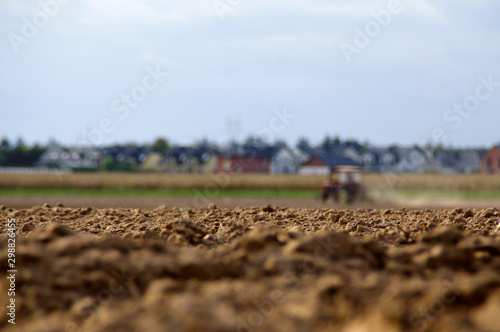 Plowing the dry soil with an tractor