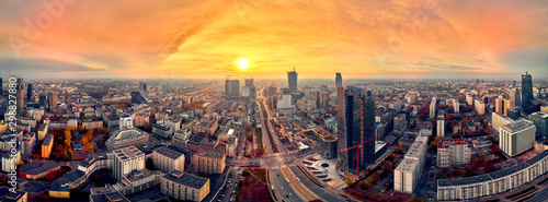 Beautiful panoramic aerial drone view to panorama cityscape of Warsaw modern City, Mennica Legacy Tower (140m) office skyscraper and Warsaw Spire, Warsaw, Poland