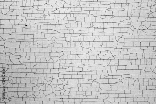 Cracks on metal texture in black and white.