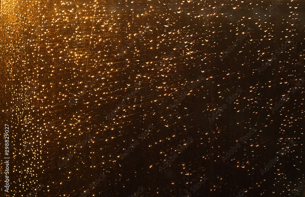 Rain drops and defocused sky background.