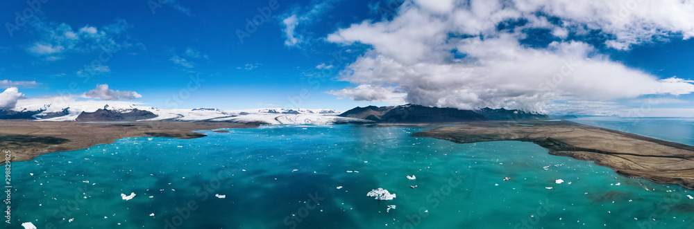 Iceland, panorama of Jokulsarlon lagoon. Picturesque blue landscape of Icelandic glacier lagoon. Icelandic famous landmark during summer season.