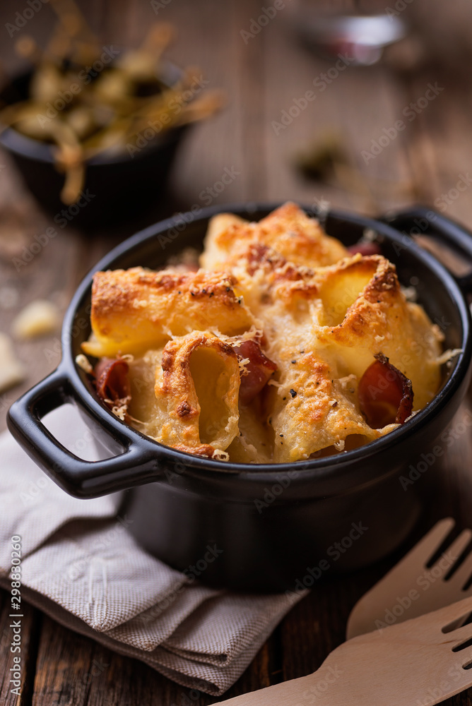 Pasta dish with cheese and prosciutto Pasta dish with cheese and prosciutto