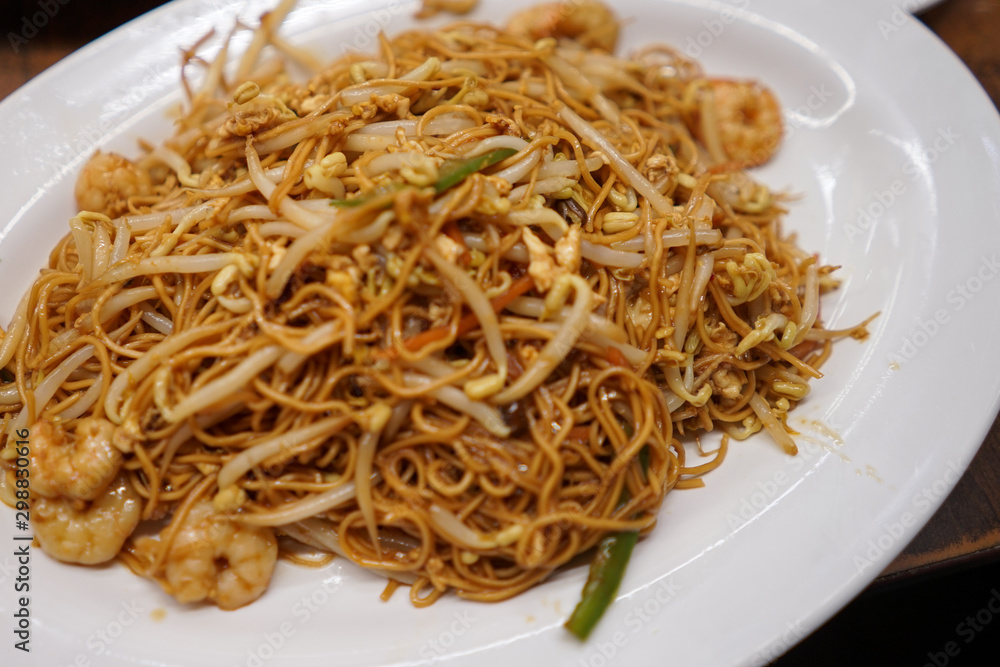 Fried noodles with vegetables and shrimps. Asian cuisine dish Fried noodles with vegetables and shrimps. Asian cuisine dish