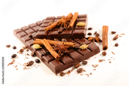 chocolate bar with spices on white background
