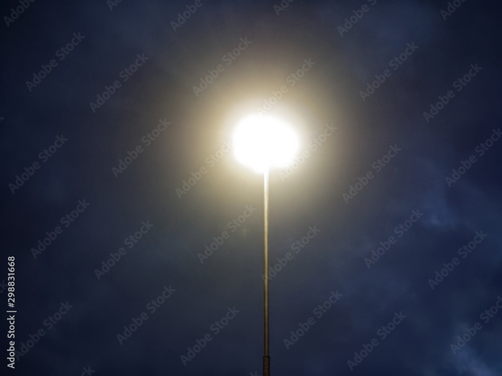 street lamp shines at night, Moscow.