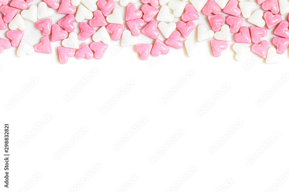 sugar hearts colored white and rose on white background