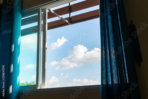 Cloudy blue sky outside the window