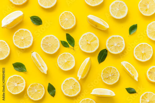 Dekoracja na wymiar  lemon-and-leaves-pattern-on-yellow-background-top-view