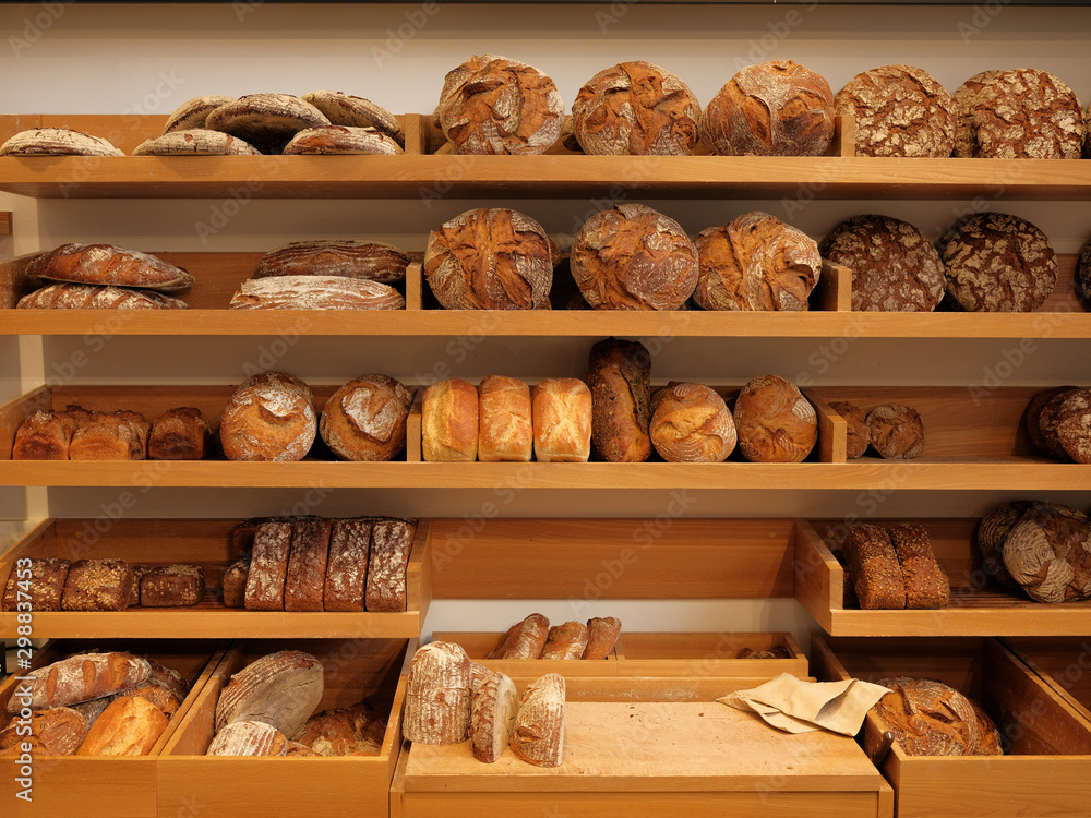 Modern bakery with different kinds of bread, cakes and buns