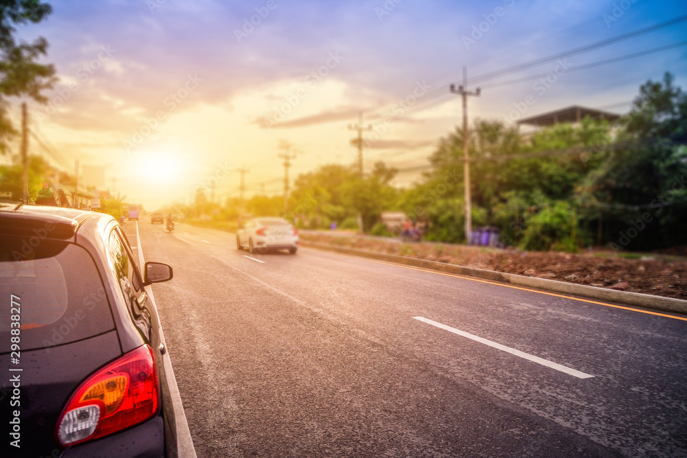 Car parked on road,car parked on street sunset background in spring nature day. Car parked on road,car parked on street sunset background in spring nature day.