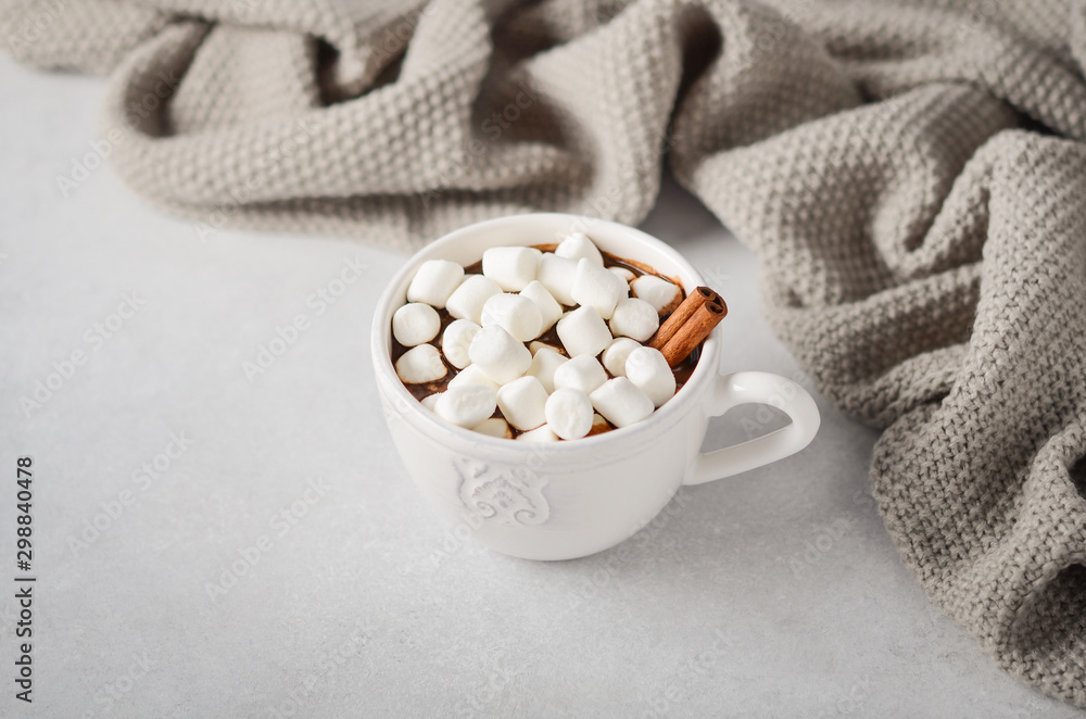 Cup of hot chocolate with marshmallows on a grey concrete background. Cup of hot chocolate with marshmallows on a grey concrete background.