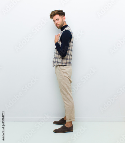 young man full body posing against white background photo