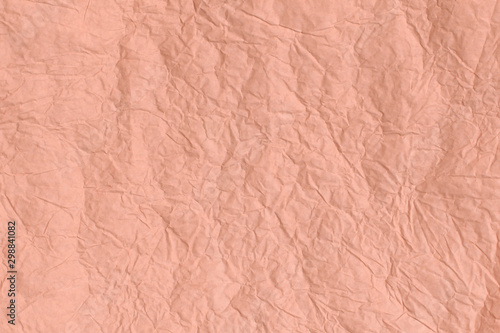 Trendy Cantaloupe colored textured background. Crumpled paper texture.