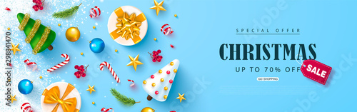 Christmas sale web banner. Holiday background with cute Christmas trees,gold stars, Rowan bunches, balls ,gift boxes and candy.Vector illustration for website,posters,ads,coupons,promotional material.