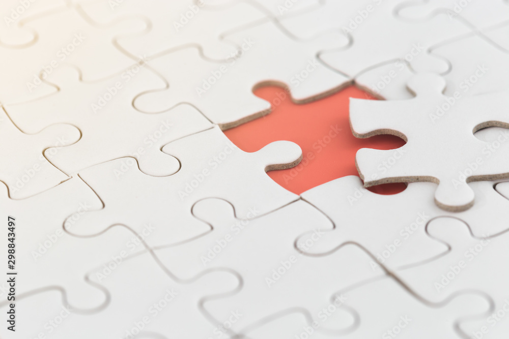 white jigsaw puzzle with missing piece with orange color. white jigsaw puzzle with missing piece with orange color.