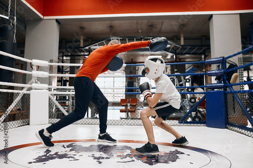 Cuadro en lienzo professional trainer teaching children to be skilled sportsmen