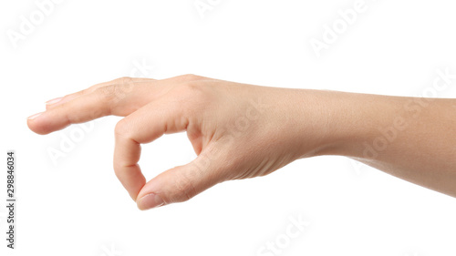 Hand of woman showing OK gesture on white background