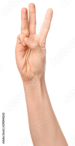 Hand of woman showing three fingers on white background