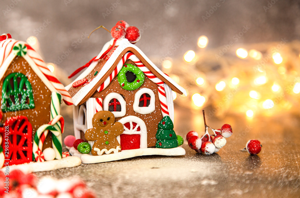 gingerbread, Christmas gingerbread house on the background of a New Year's  garland Stock Photo | Adobe Stock