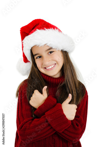 Portrait of happy little girl in Santa hat showing ok sign isolated on white background