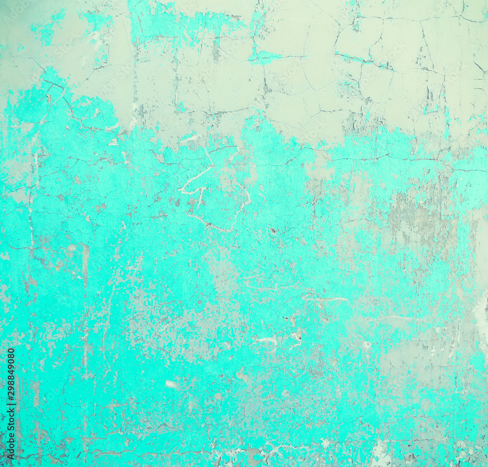 Texture of an old plastered wall painted with blue and white paint.