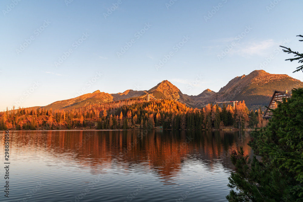 Strbske pleso lake with peaks above in Vysoke Tatry mountains in Slovakia during autumn morning
