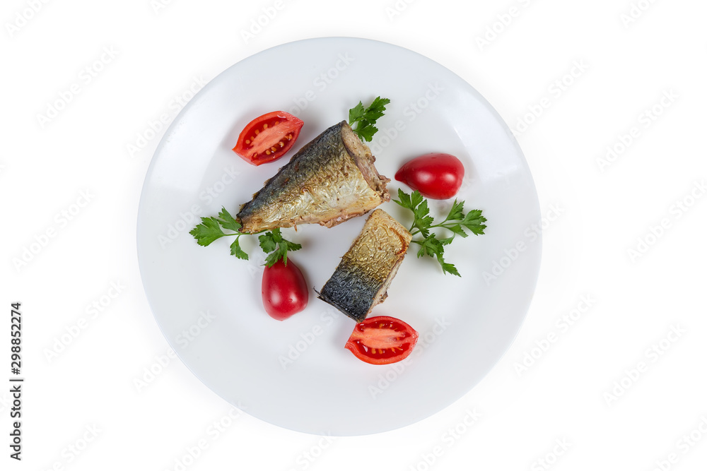 Top view of baked mackerel slices with greens and tomatoes Top view of baked mackerel slices with greens and tomatoes