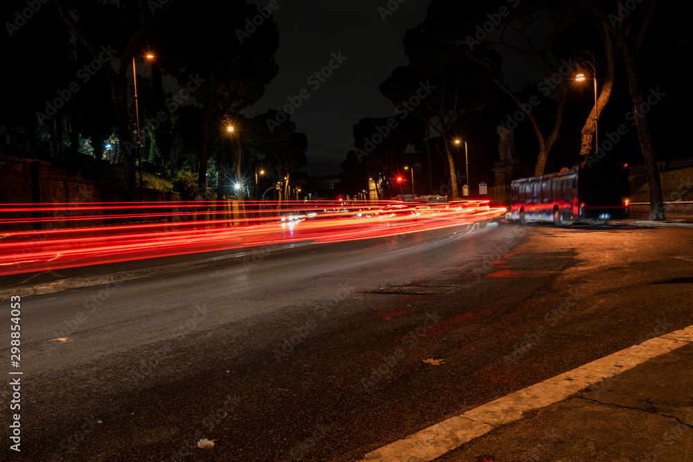 light trails of the cars in the way of the imperial holes, Rome