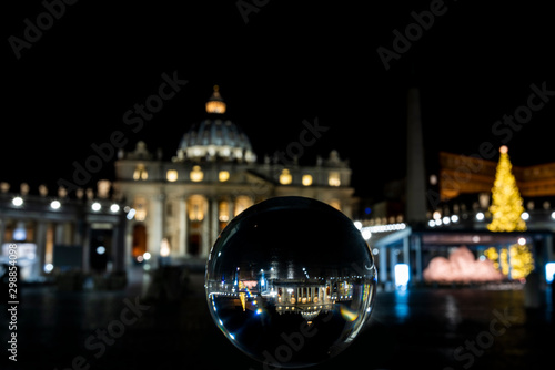view of St. Peter ( San Pietro ) through a crystal ball, Rome at night