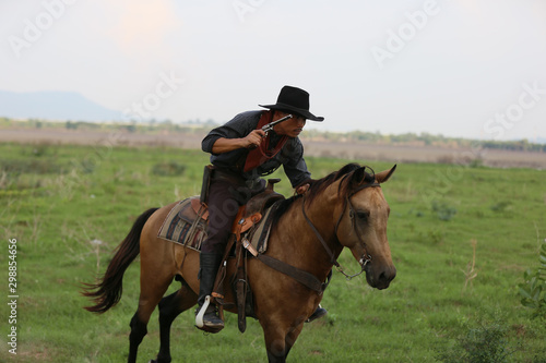 cowboy and horse at first light,mountain, river and lifestyle with natural light background  © FotoArtist