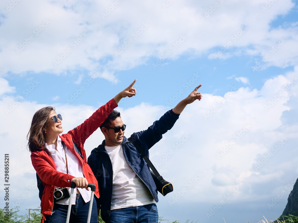 Asian tourists couple have fun with nature background, lifestyle concept. Asian tourists couple have fun with nature background, lifestyle concept.