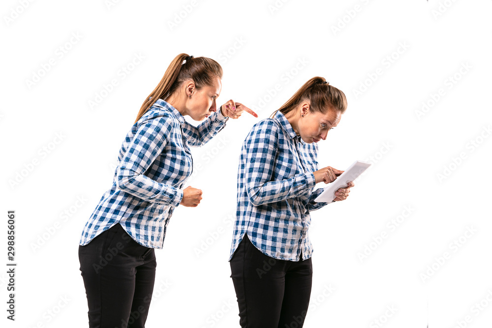 Young handsome woman arguing with herself on white studio background. Concept of human emotions, expression, mental issues, internal conflict, split personality. Half-length portrait. Negative space. Young handsome woman arguing with herself on white studio background. Concept of human emotions, expression, mental issues, internal conflict, split personality. Half-length portrait. Negative space.