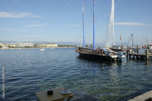 Beautiful view of the water jet fountain in the lake of Geneva Switzerland