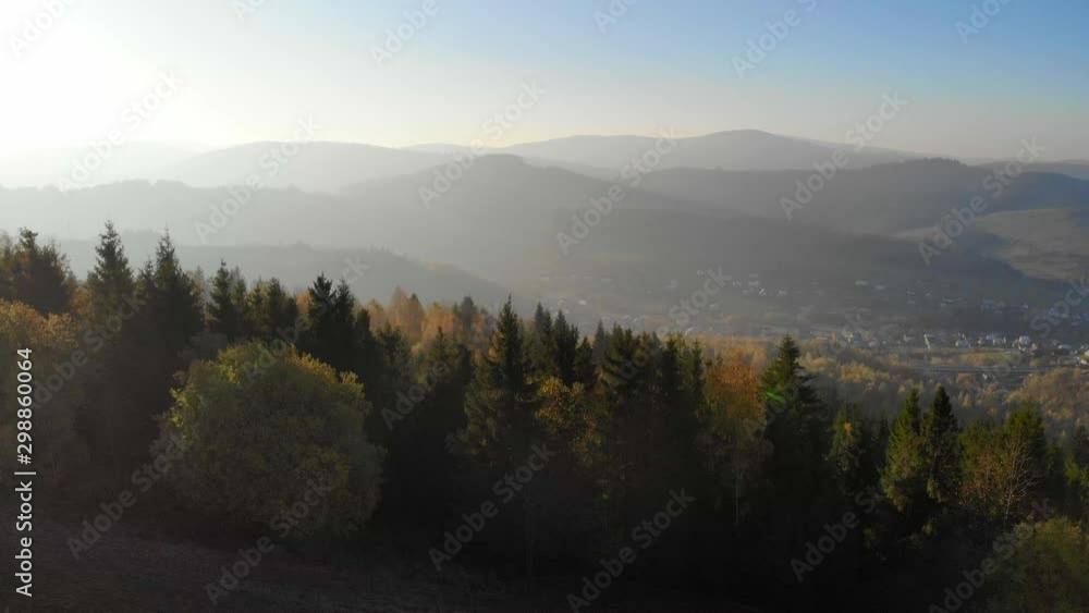 Flight over autumn mountains in the light of the setting sun. Flight over autumn mountains in the light of the setting sun.