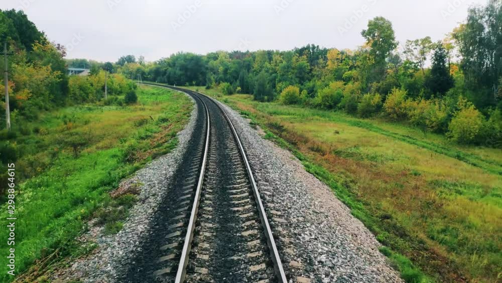 Moving along the railroad in the greenery Moving along the railroad in the greenery