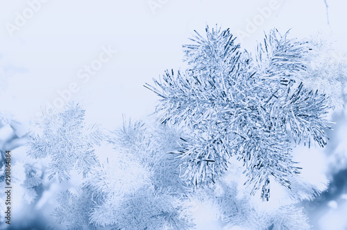 Background in blue tones with snowflakes from tinsel. © Tetiana