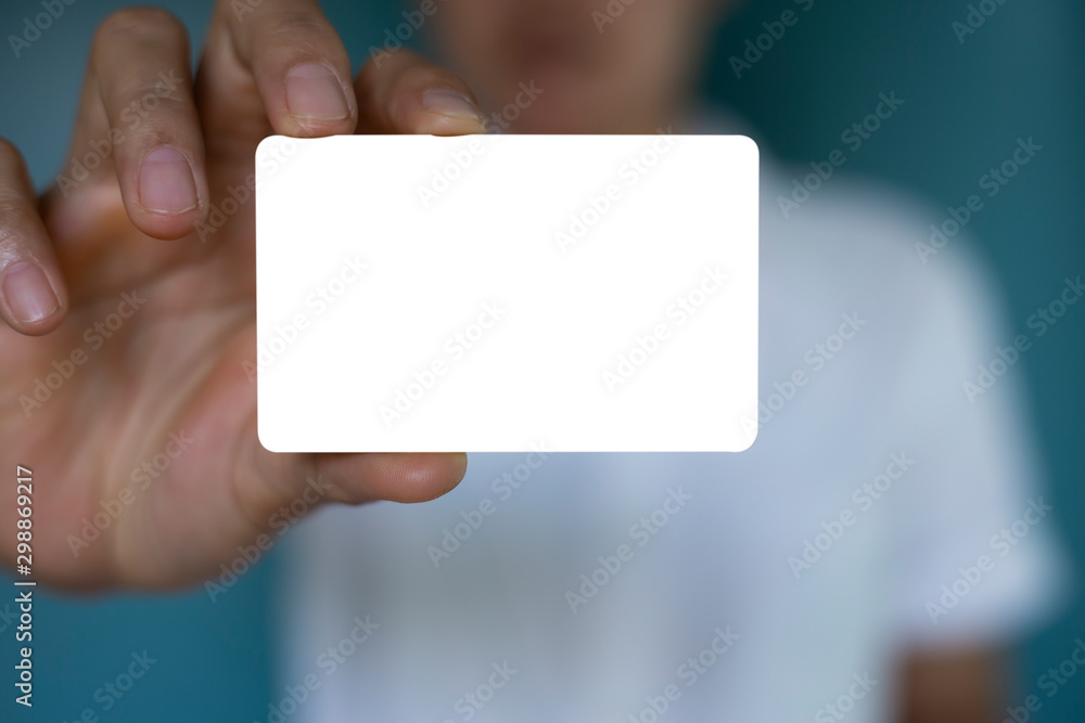 Hand holding a blank piece of paper. Close up white business card. Hand holding a blank piece of paper. Close up white business card.
