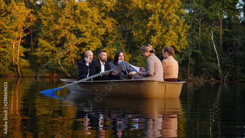 Collegues are in a boat, they are working