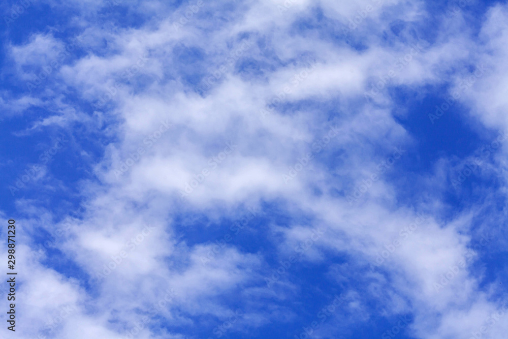 Fototapeta premium blue sky background with tiny clouds.