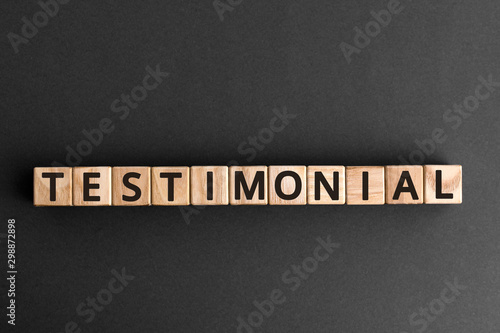Фотография Testimonial - word from wooden blocks with letters,a statement about the charact