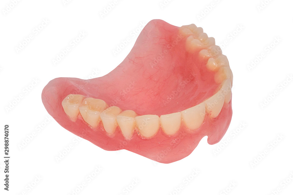 Old full removable denture. Plastic denture of the upper jaw. Dental photo Isolated on white Old full removable denture. Plastic denture of the upper jaw. Dental photo Isolated on white