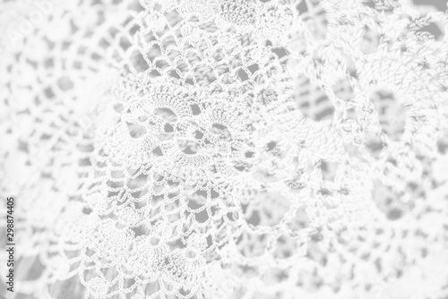 Abstract vintage white background, knitted homemade delicate lace of crochet napkins in retro style, double exposure photo
