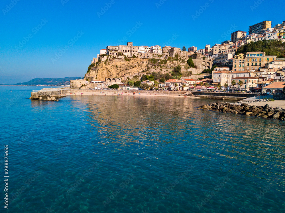 Aerial view of Pizzo Calabro, pier, castle, Calabria, tourism Italy. Panoramic view of the small town of Pizzo Calabro by the sea. Houses on the rock. On the cliff stands the Aragonese castle