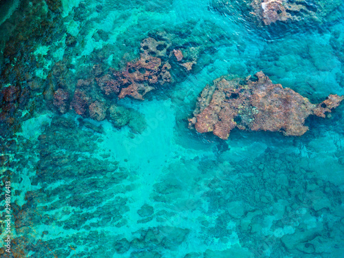 Aerial view of rocks in the sea. Overview of the seabed seen from above, transparent water. Seabed. Pizzo Calabro, Calabria, Italy © Naeblys