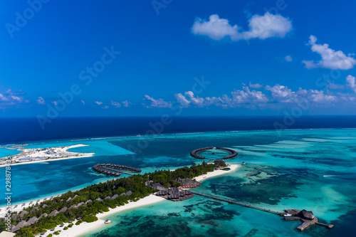 Aerial view, lagoon of Maldives island Olhuveli with water bungalows South Male Atoll, Maldives photo