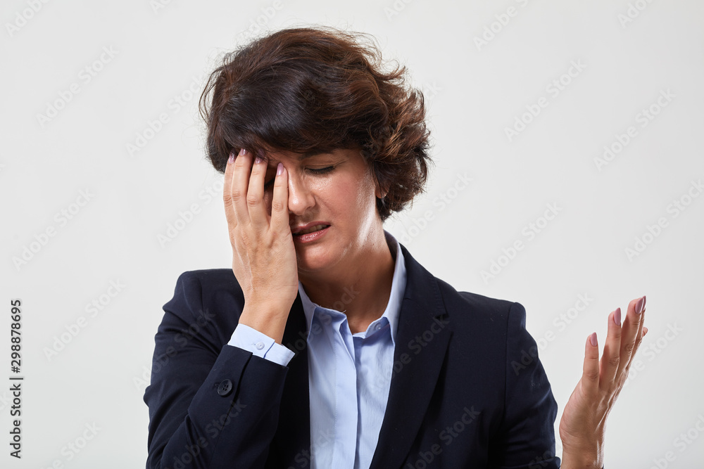 Senior businesswoman with migraine Senior businesswoman with migraine